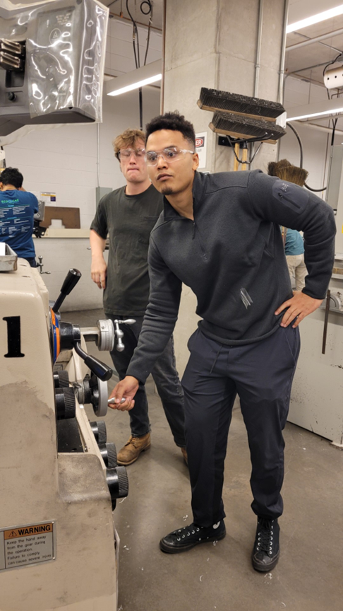 Kwaku Richter working in a machine shop